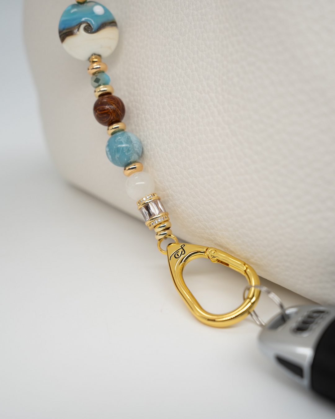 LD Keyfinder Equinox Harmony featuring artisan glass moon bead, moonstone, larimar, jasper, and 18KT gold-plated accents.