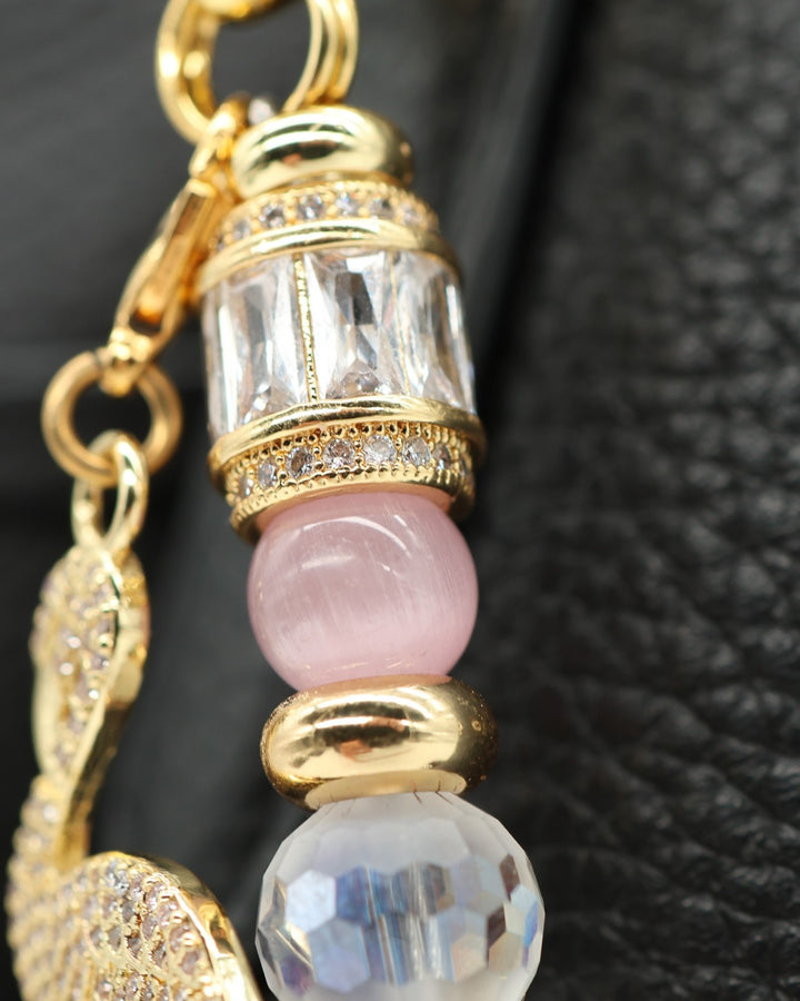 LD Keyfinder Flamingo Fantasy accessory featuring pink opal, cat's eye beads, crystal, and a gold flamingo charm.