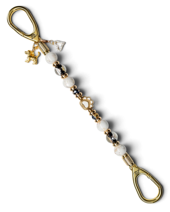 LD Keyfinder Furever Love keychain with white seashell beads, gold paw charm, and rhinestone heart on gold hardware.
