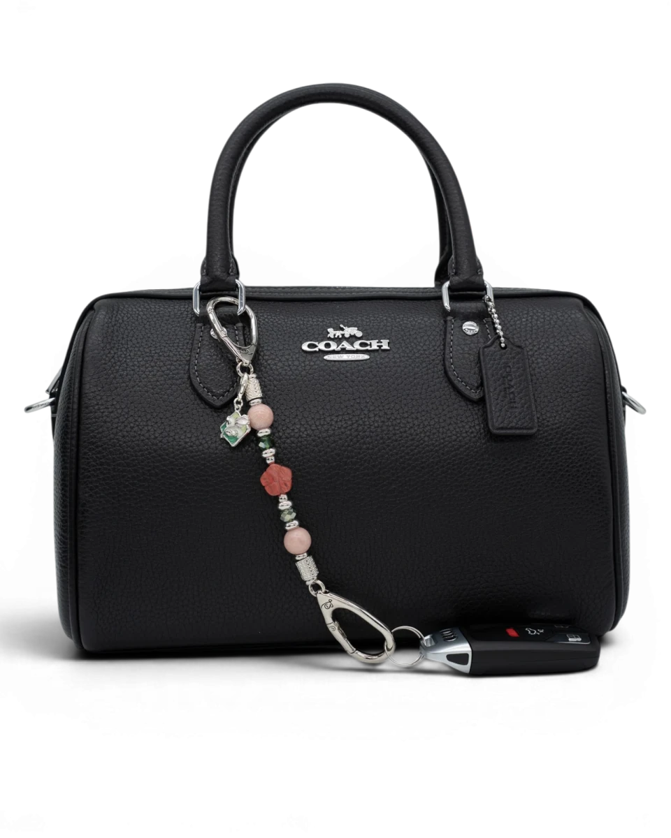 LD Keyfinder Garden Bliss-Mini accessory with pink opal, cherry quartz flower, and green glass beads on a black handbag.