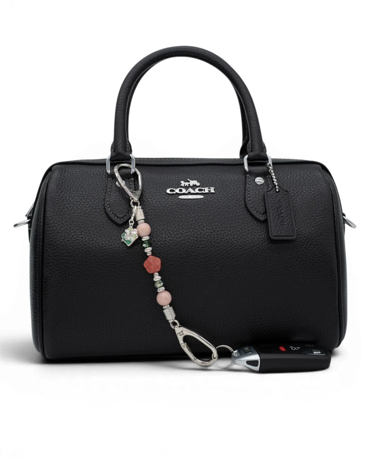 LD Keyfinder Garden Bliss-Mini accessory with pink opal, cherry quartz flower, and green glass beads on a black handbag.