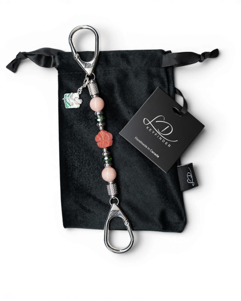 LD Keyfinder Garden Bliss-Mini featuring pink opal beads, cherry quartz flower, and enamel bouquet charm on velvet bag
