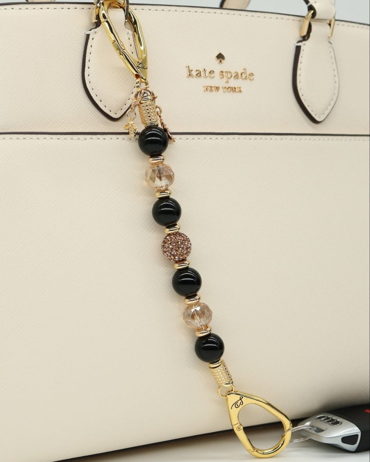 LD Keyfinder Gilded Bee charm with black obsidian, crystal beads, flower, and bumblebee charms.