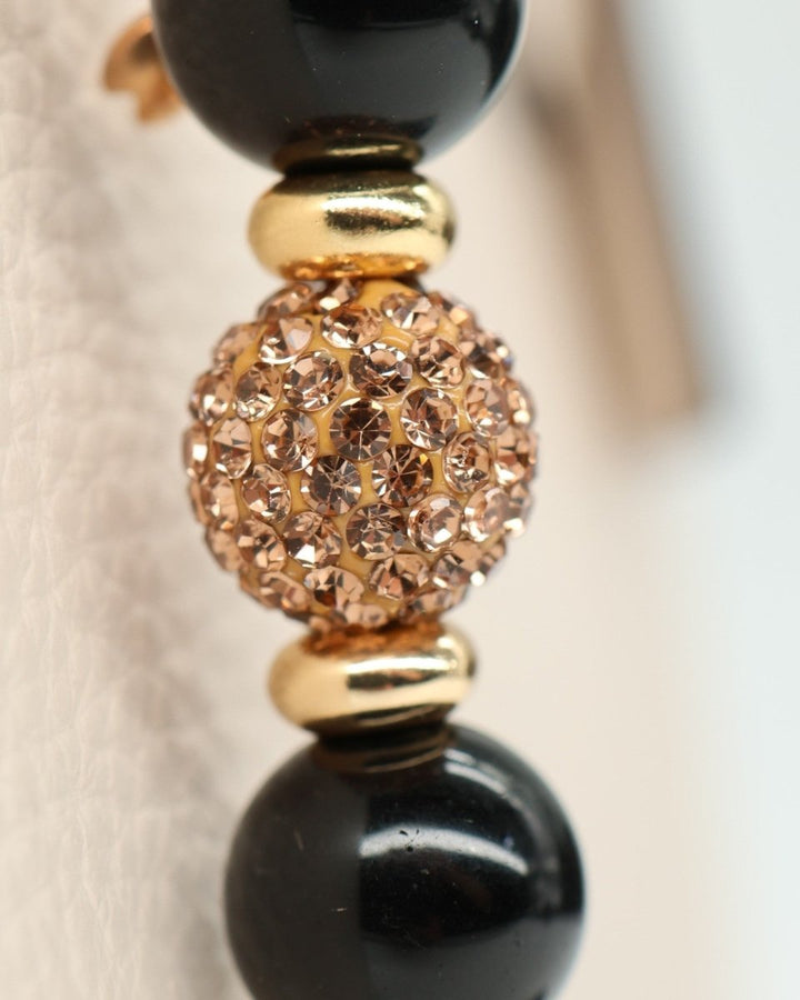 LD Keyfinder Gilded Bee Mini bracelet with black obsidian beads, gold spacers, and crystal-embellished center bead.