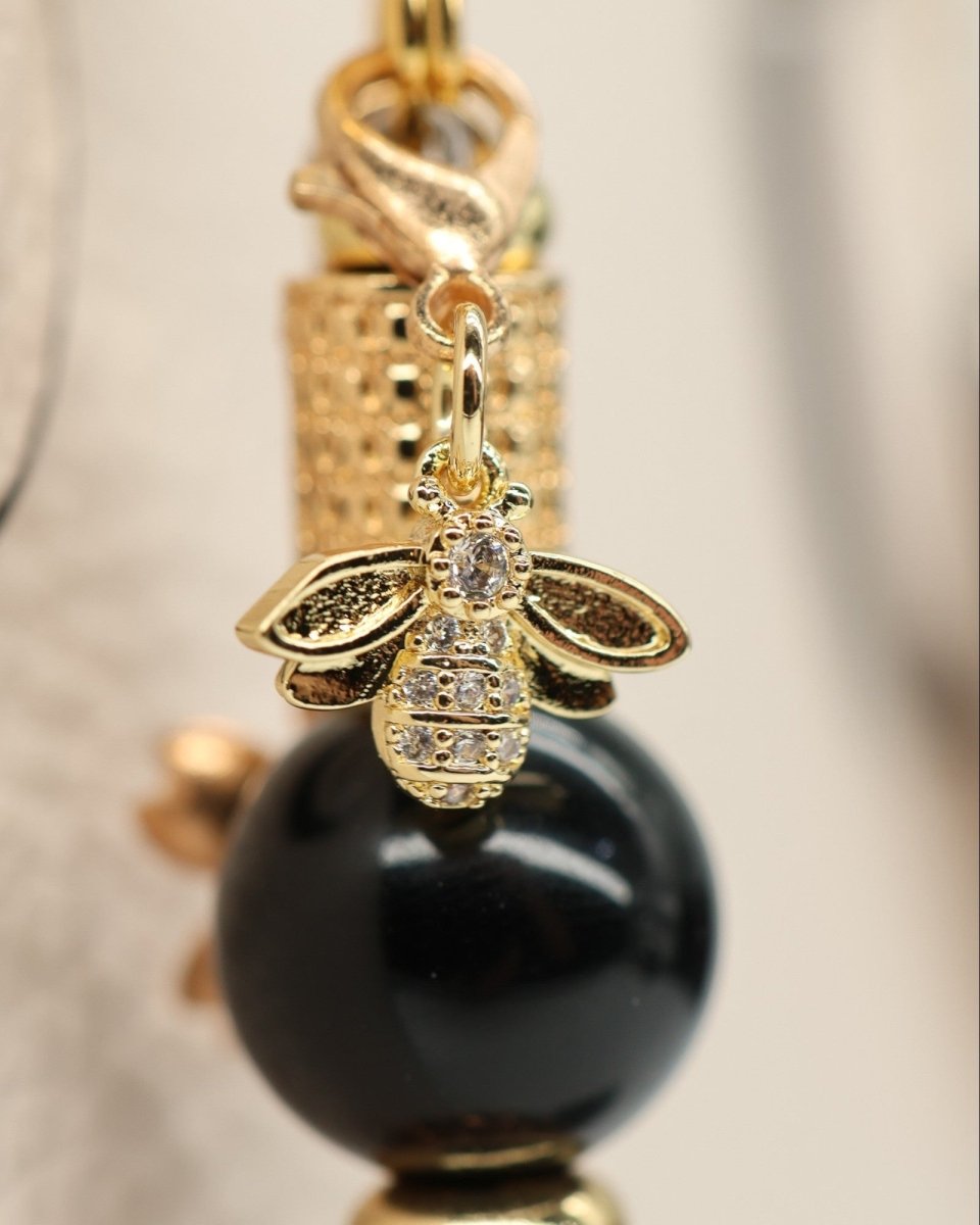 LD Keyfinder Gilded Bee Mini bracelet with black obsidian beads, gold accents, and rhinestone bee charm.