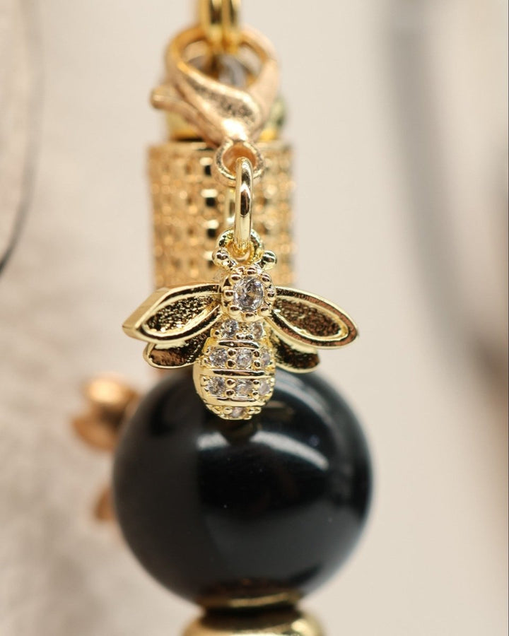 LD Keyfinder Gilded Bee Mini bracelet with black obsidian beads, gold accents, and rhinestone bee charm.