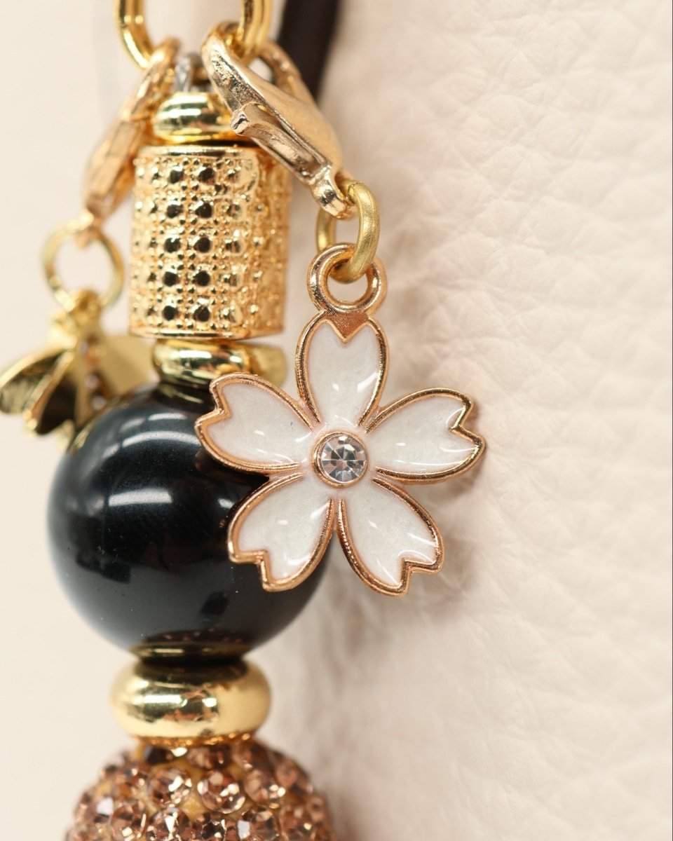 LD Keyfinder Gilded Bee Mini charm with black obsidian, gold accents, white flower, and bee charms.