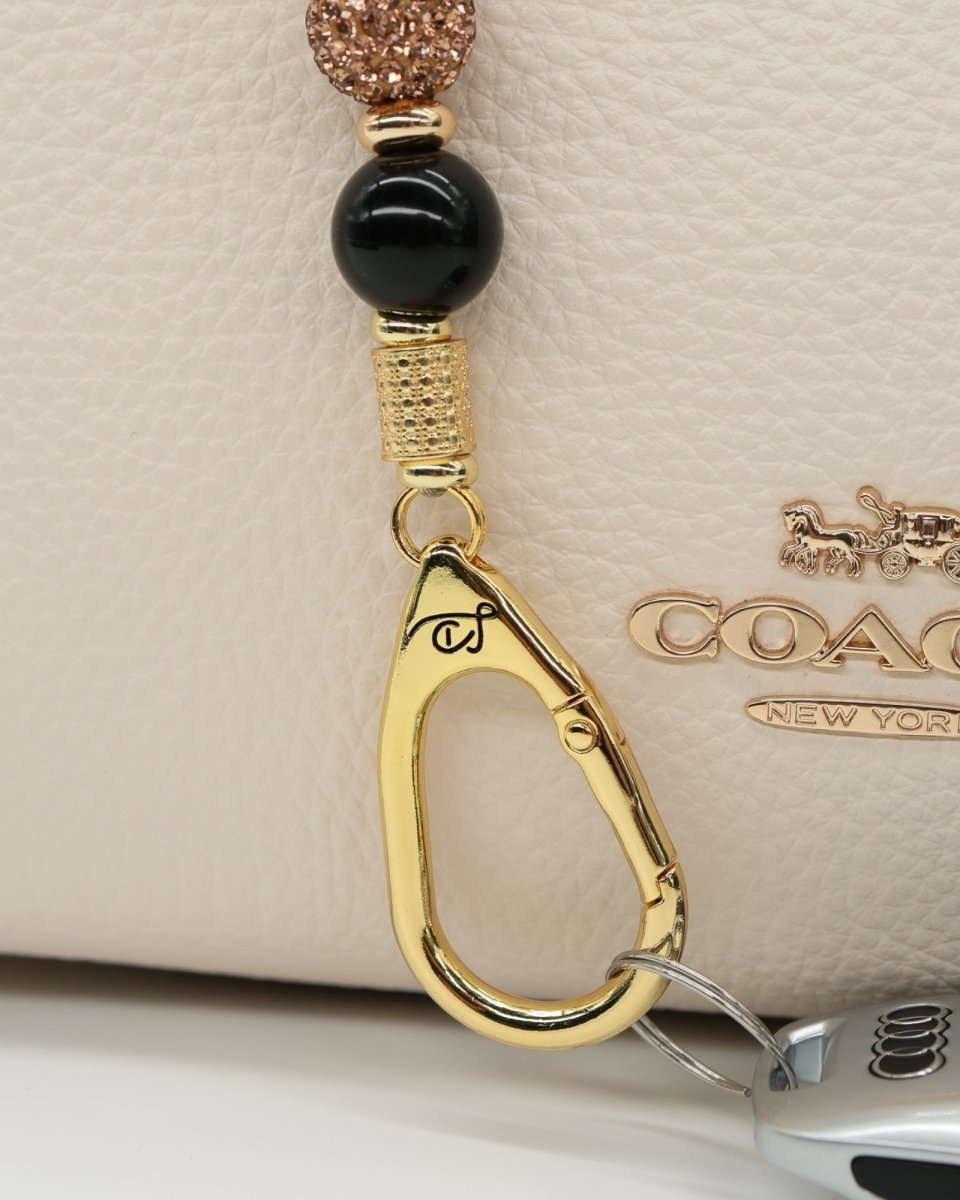 LD Keyfinder Gilded Bee Mini keychain with black obsidian beads, crystal-accented bead, and gold charms.