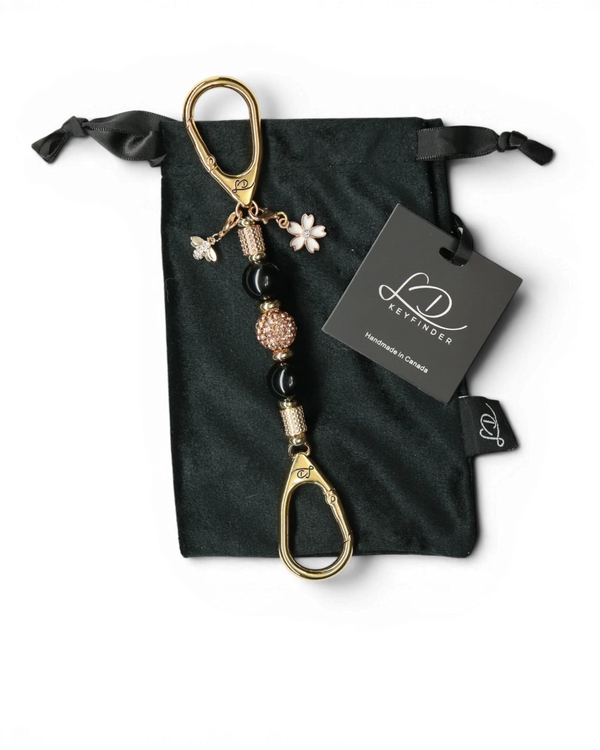 LD Keyfinder Gilded Bee Mini keychain with black obsidian beads, rose gold crystal bead, flower charm, and bee charm.