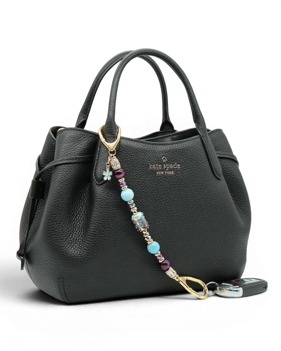 LD Keyfinder Gilded Fantasy keychain with sky blue, topaz, purple, and gold beads, a blue flower charm, and a rhinestone accent.
