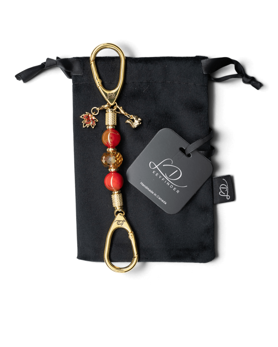 LD Keyfinder Golden Autumn Mini featuring agate beads, amber crystal, gold squirrel, and maple leaf charms on velvet