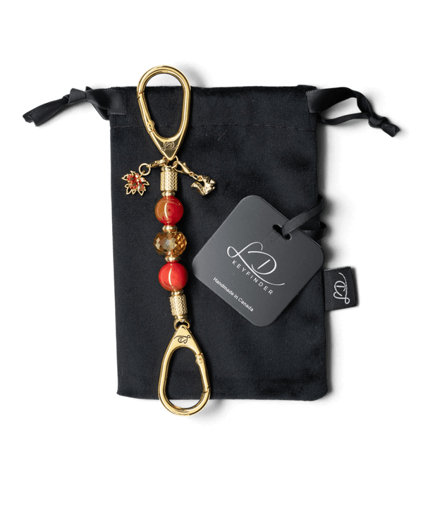 LD Keyfinder Golden Autumn Mini featuring agate beads, amber crystal, gold squirrel, and maple leaf charms on velvet