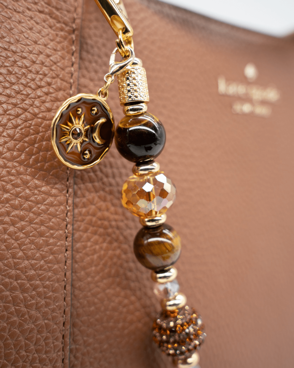 LD Keyfinder Golden Equinox beaded key chain with Tiger Eye, faceted crystals, and a gold sun and moon charm.