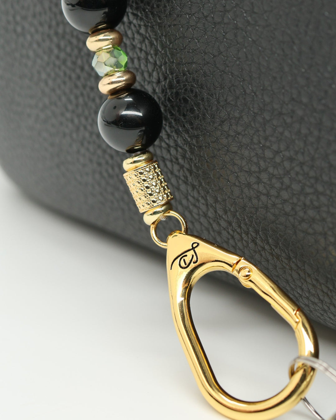 LD Keyfinder Golden Fairway beaded keychain with black obsidian, moss green crystals, and 18KT gold plated accents.