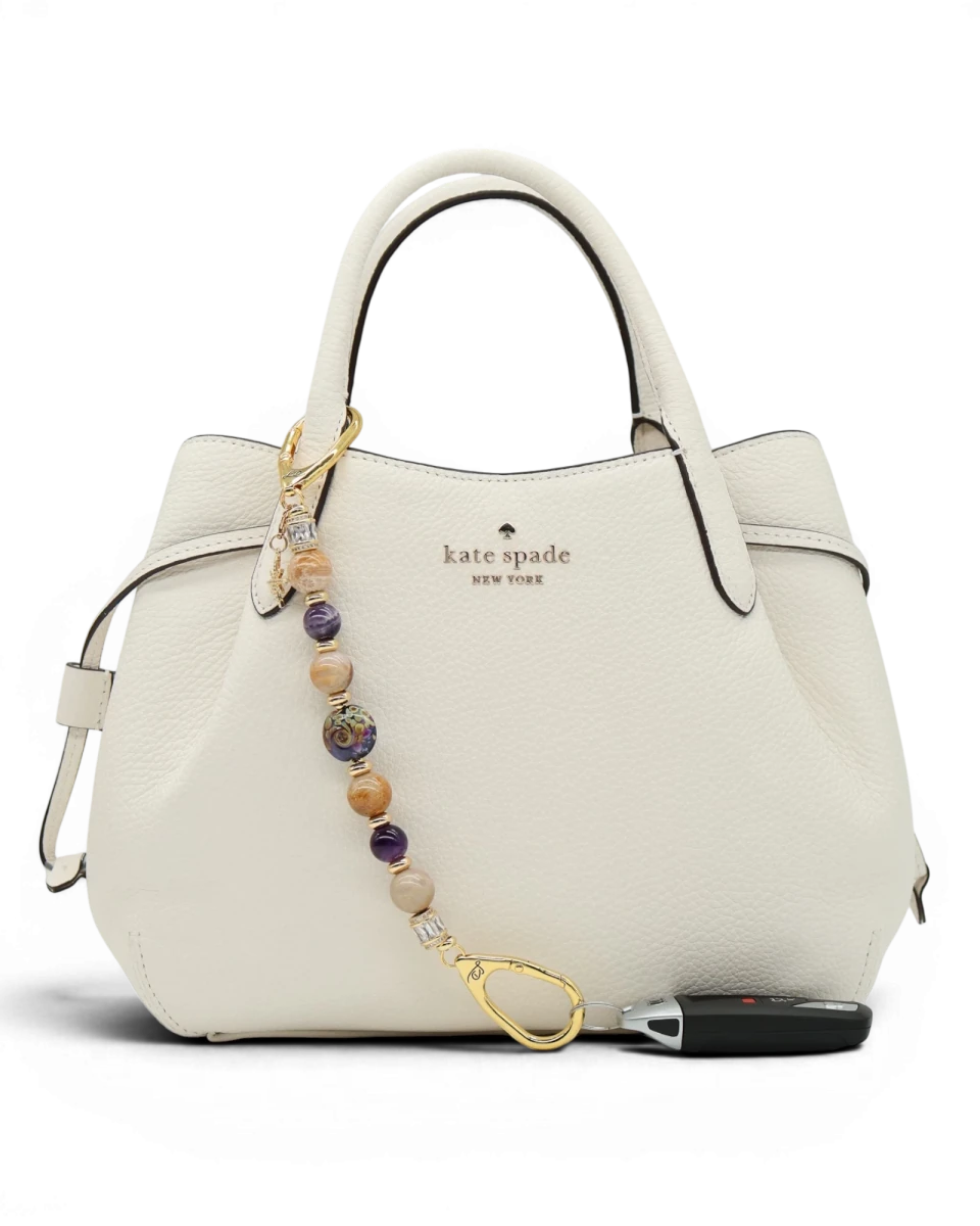 LD Keyfinder Golden Nebula keychain with purple, gold, and amethyst beads, gold-plated star charm, and baguette rhinestones.