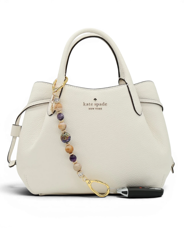 LD Keyfinder Golden Nebula keychain with purple, gold, and amethyst beads, gold-plated star charm, and baguette rhinestones.