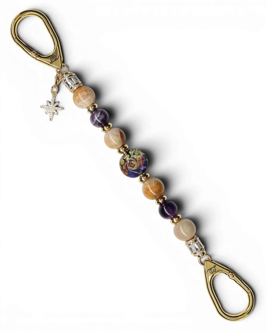 LD Keyfinder Golden Nebula keychain with purple and gold artisan glass bead, fossil coral, amethyst, and gold-plated star charm.