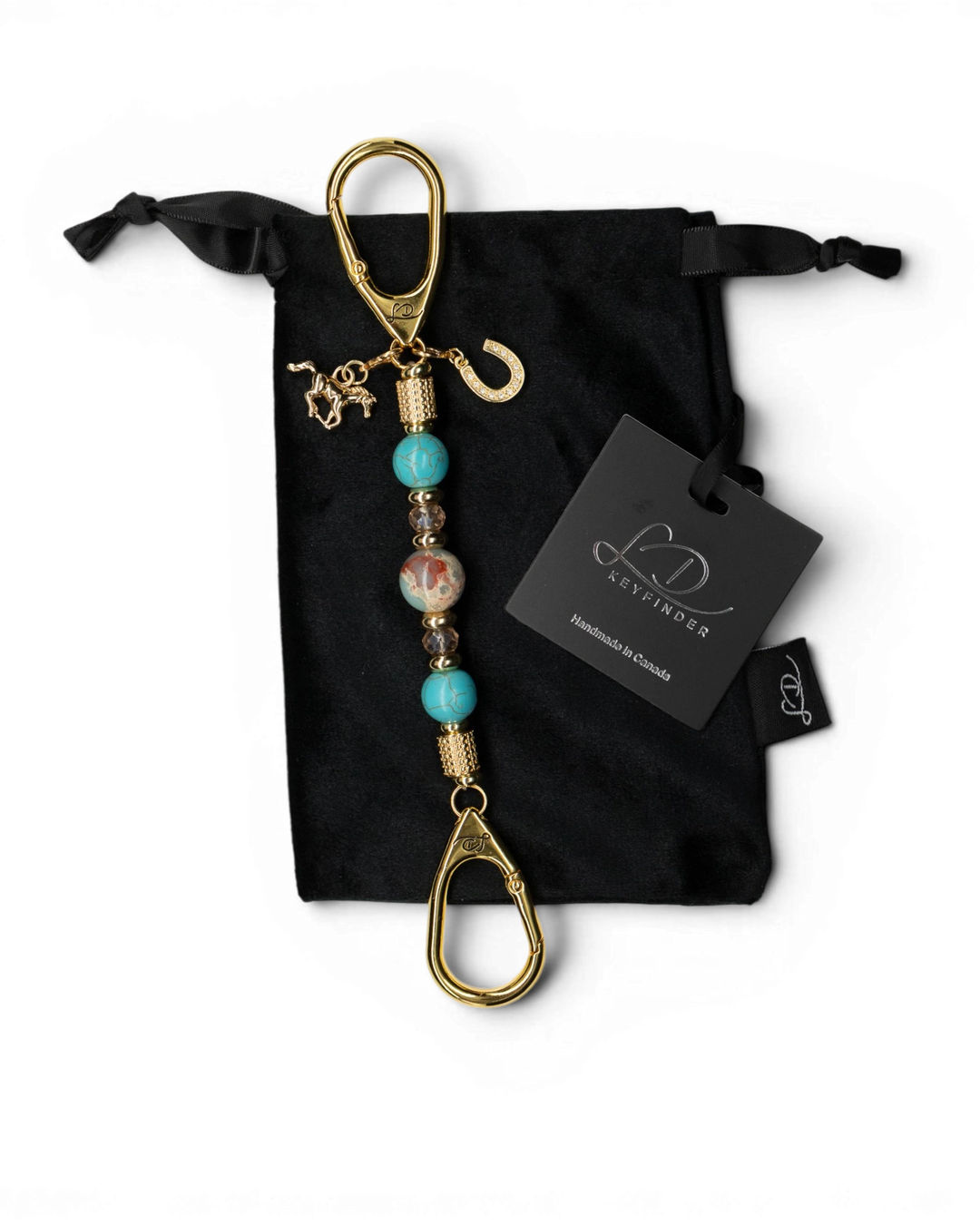 LD Keyfinder Golden Prairie Mini beaded keychain with turquoise, jasper, and gold charms on a black velvet pouch.