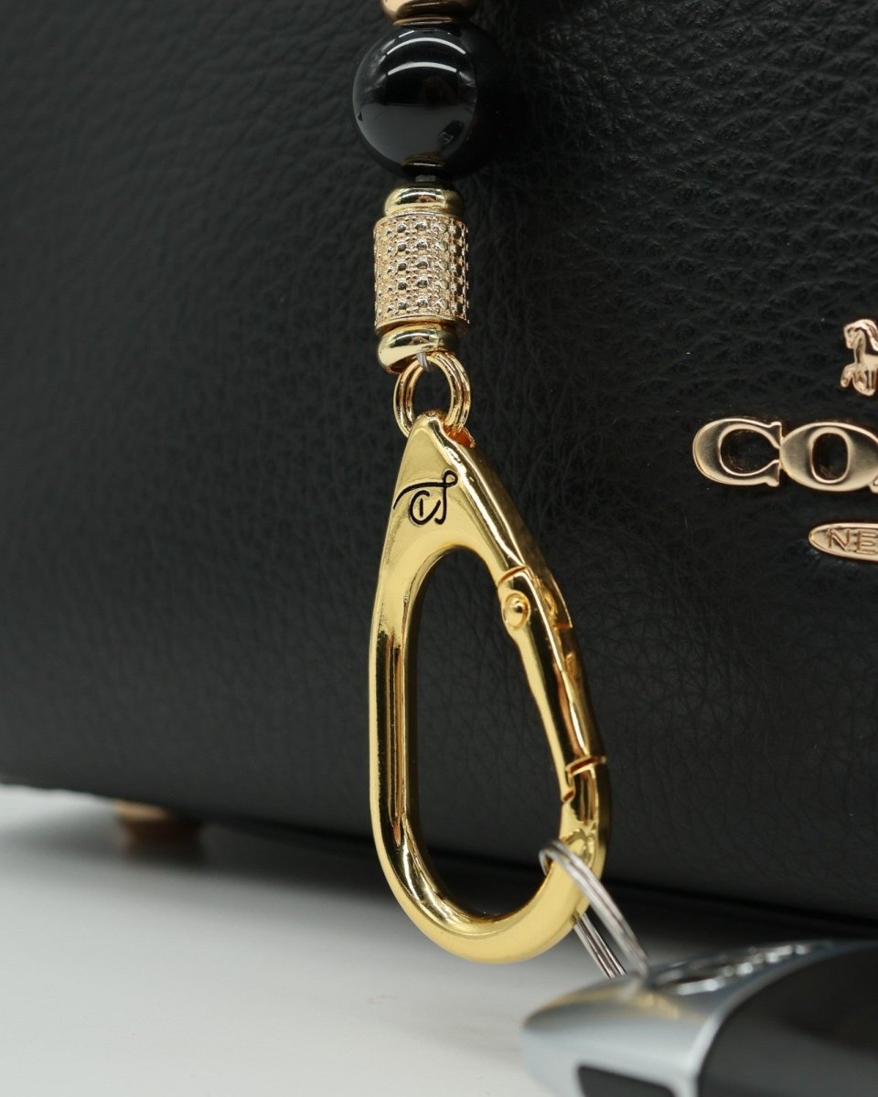 LD Keyfinder Golden Purrs-Mini featuring black obsidian beads, gold-plated accents, and a cat head lampwork glass bead.