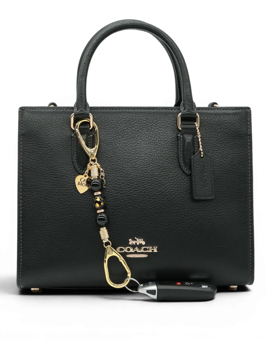 LD Keyfinder Golden Purrs-Mini featuring black obsidian beads, gold cat charm, and lampwork glass cat head on a bag.