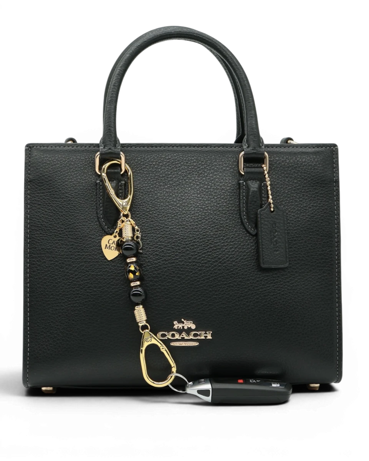 LD Keyfinder Golden Purrs-Mini featuring black obsidian beads, gold cat charm, and lampwork glass cat head on a bag.
