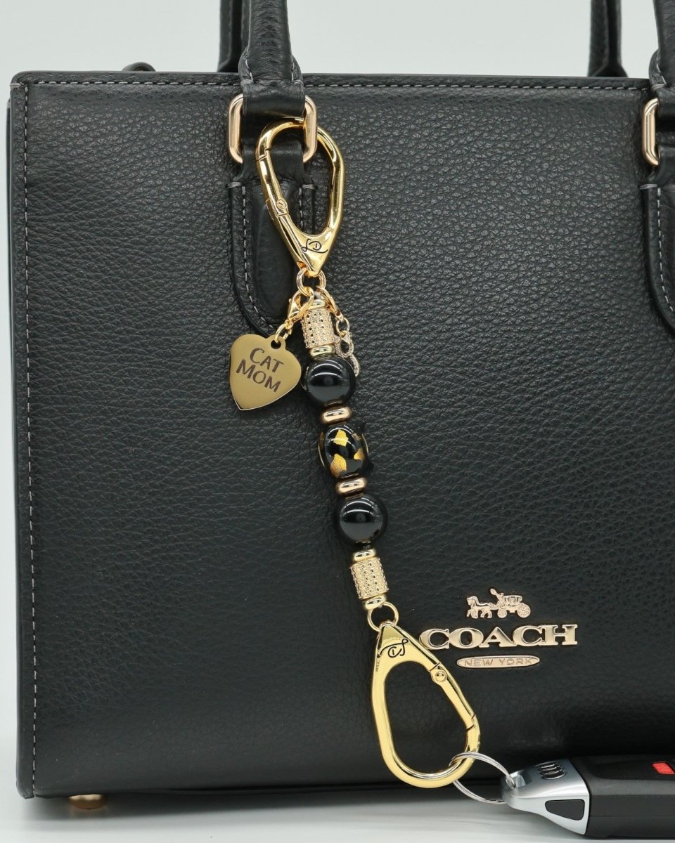 LD Keyfinder Golden Purrs-Mini featuring black obsidian beads, gold cat charms, and a cat head lampwork glass bead.