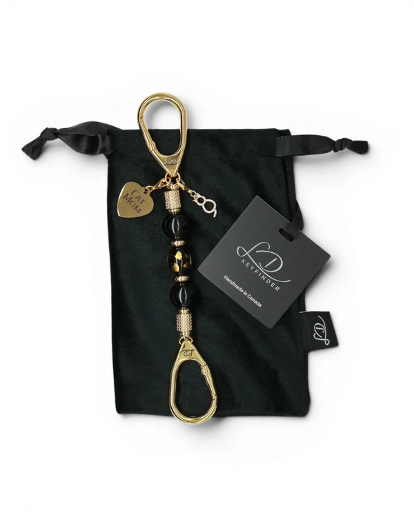 LD Keyfinder Golden Purrs-Mini keychain with black obsidian beads, gold cat charm, and Cat Mom heart on velvet pouch.