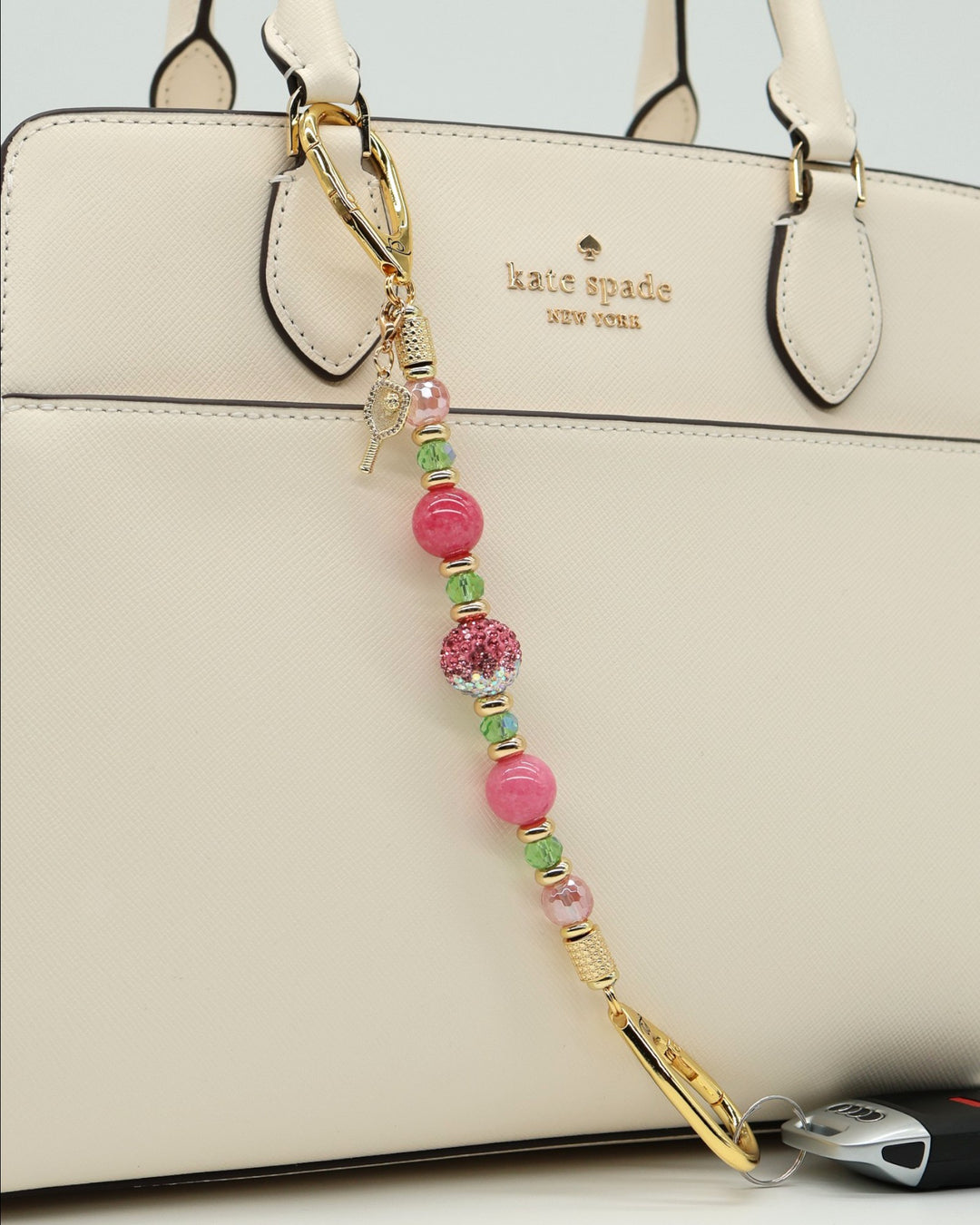 LD Keyfinder Golden Rally beaded keychain with cherry quartz, lime glass, jade, and a pickleball paddle charm.