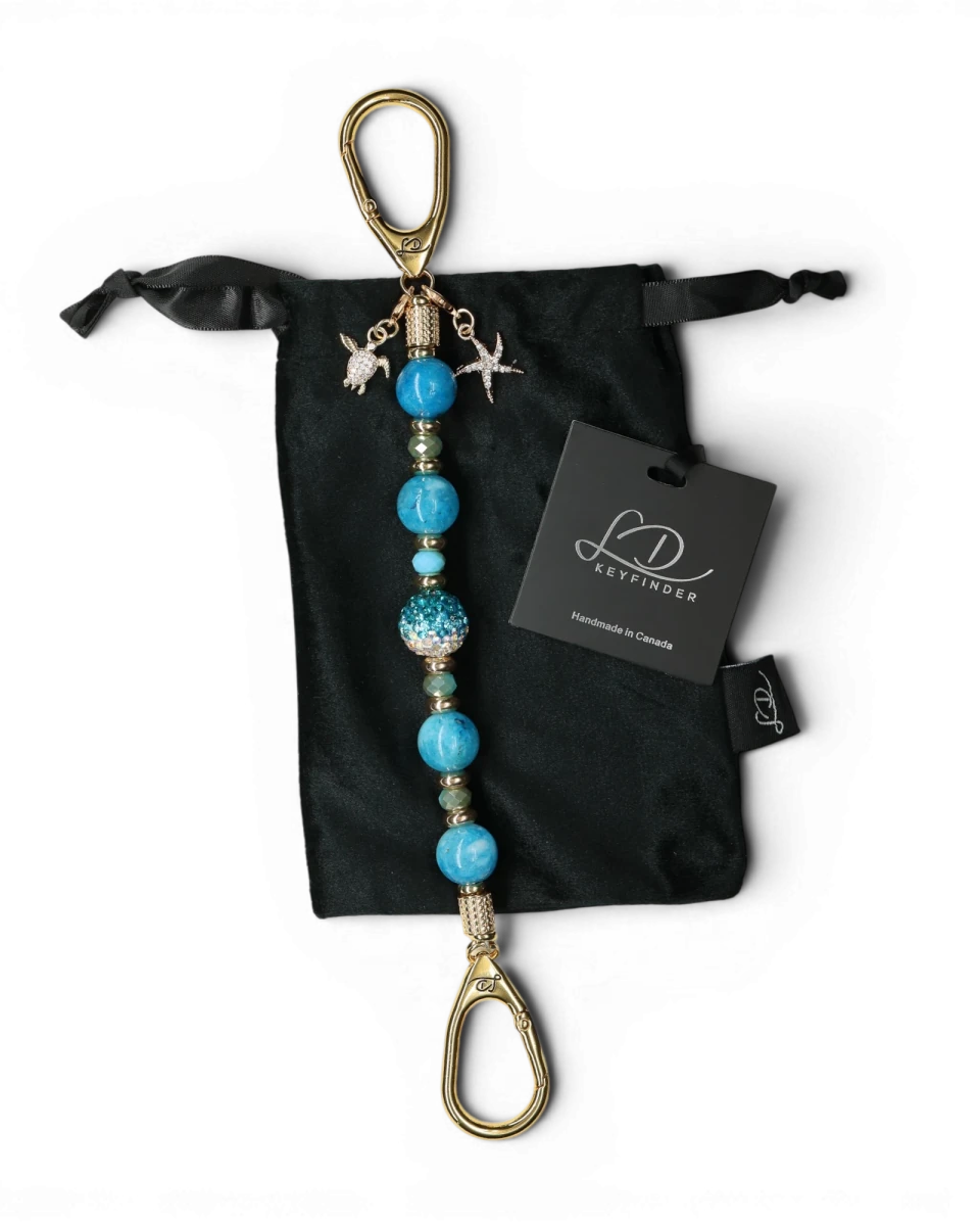 LD Keyfinder Golden Reef keychain with aqua hemimorphite beads, crystal center bead, starfish and turtle charms, gold-plated hardware.