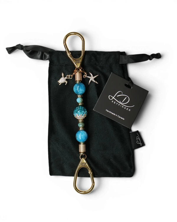 LD Keyfinder Golden Reef Mini keychain with aqua hemimorphite beads, crystal center, starfish & turtle charms, 18k gold plating.