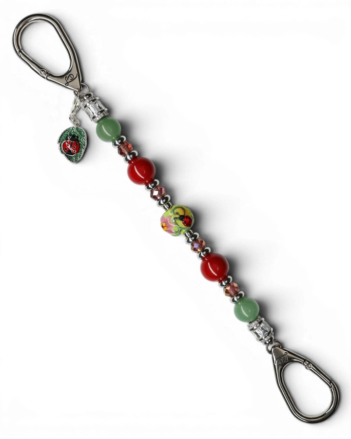 LD Keyfinder Ladybug Love beaded keychain with green aventurine, red shell pearls, and artisan ladybug glass bead.