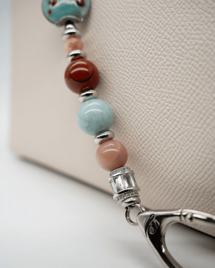 LD Keyfinder Maple Majesty beaded accessory featuring red jasper, jade, and artisan glass beads with platinum accents.