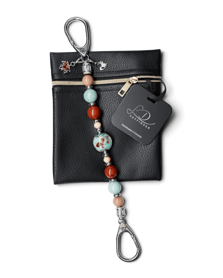 LD Keyfinder Maple Majesty beaded keychain with artisan glass, Red Jasper, and charms on a black leather pouch.