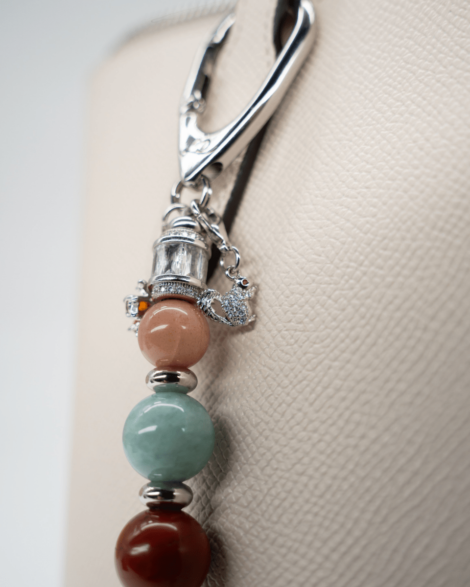 LD Keyfinder Maple Majesty accessory featuring gemstone beads, a squirrel charm, and platinum-plated accents.