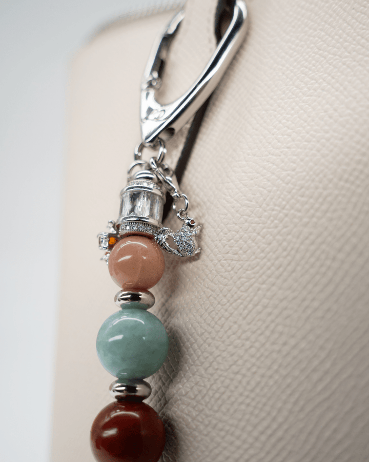 LD Keyfinder Maple Majesty accessory featuring gemstone beads, a squirrel charm, and platinum-plated accents.