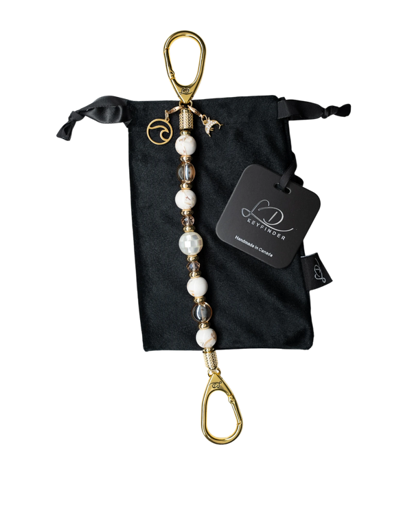 LD Keyfinder Mediterranean Glow beaded keychain with Mother of Pearl, ivory shells, gold beads, and ocean charms.