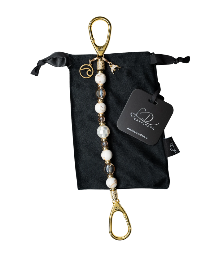 LD Keyfinder Mediterranean Glow beaded keychain with Mother of Pearl, ivory shells, gold beads, and ocean charms.