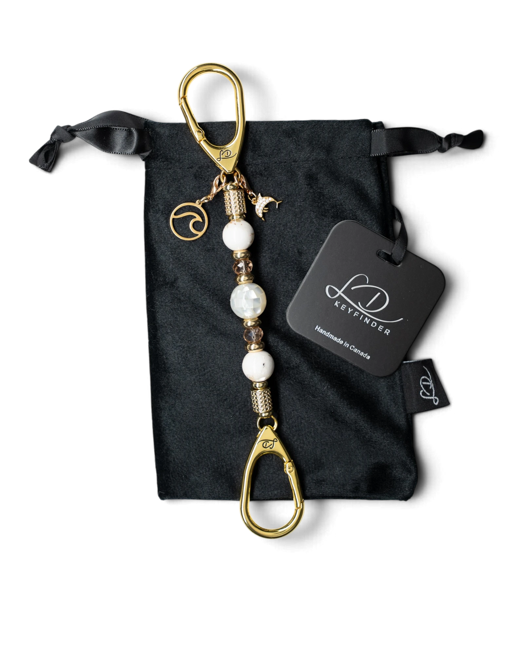 LD Keyfinder Mediterranean Glow-Mini featuring Mother of Pearl, ivory seashell beads, gold charms, and velvet pouch.