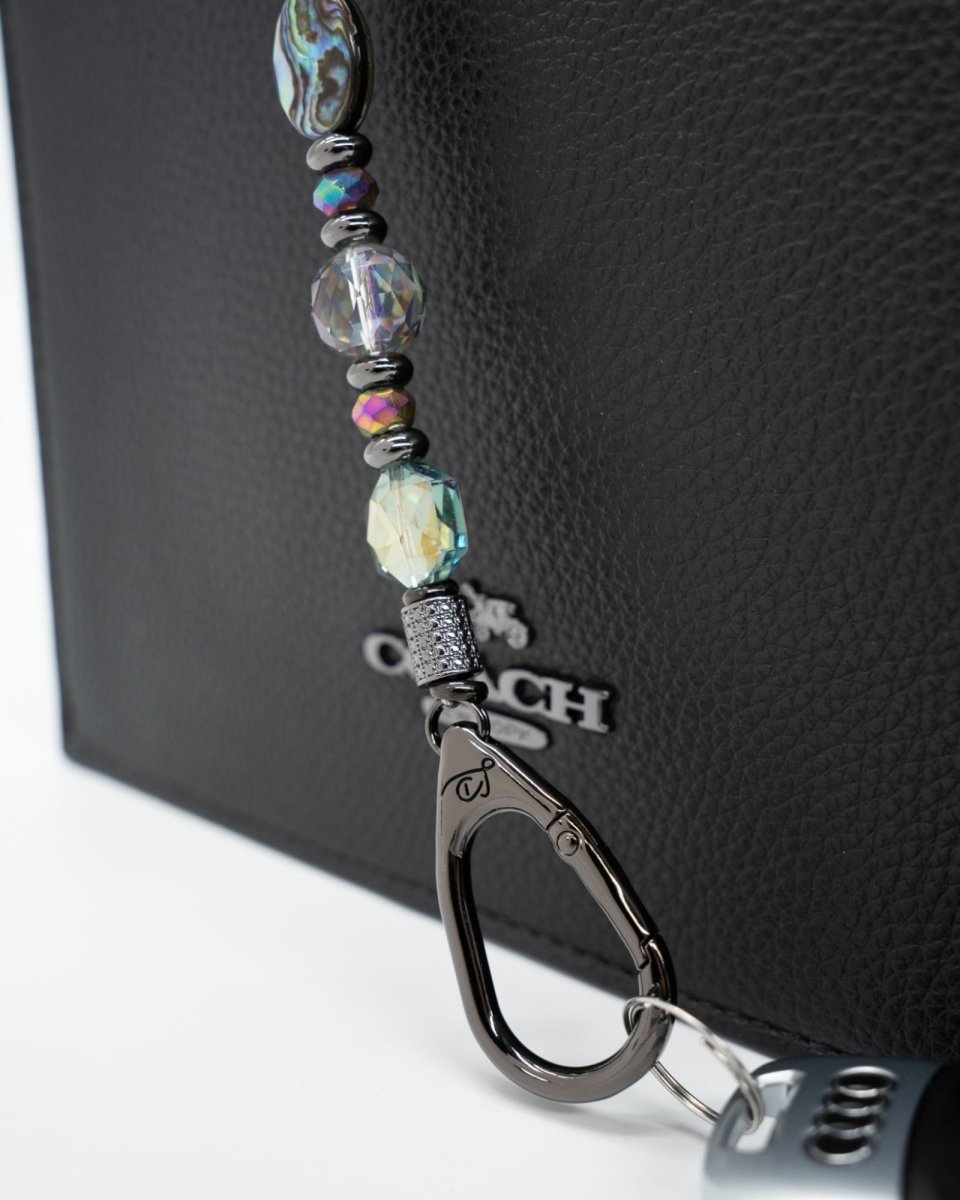 LD Keyfinder Midnight Aurora beaded keychain with abalone shell, rainbow crystal beads, and gunmetal moon and star charms