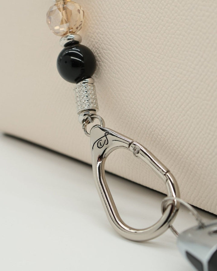 LD Keyfinder Midnight Hive lanyard with black obsidian beads, crystal bead, and silver-tone clasp.