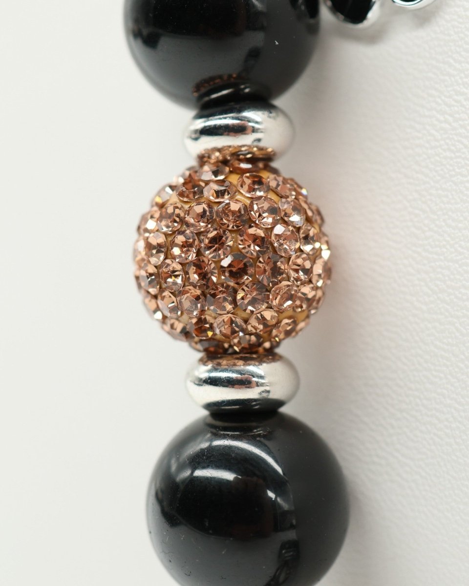 LD Keyfinder Midnight Hive Mini bracelet with black obsidian beads, crystal-embellished bead, and silver flower charm.