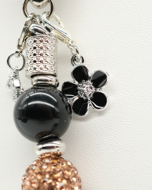 Black enamel flower charm