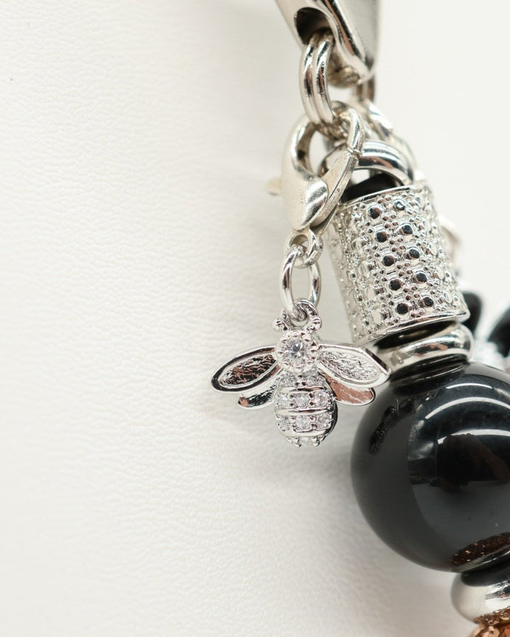 LD Keyfinder Midnight Hive Mini keychain with black obsidian beads, rhinestone bee charm, and crystal-embellished bead.
