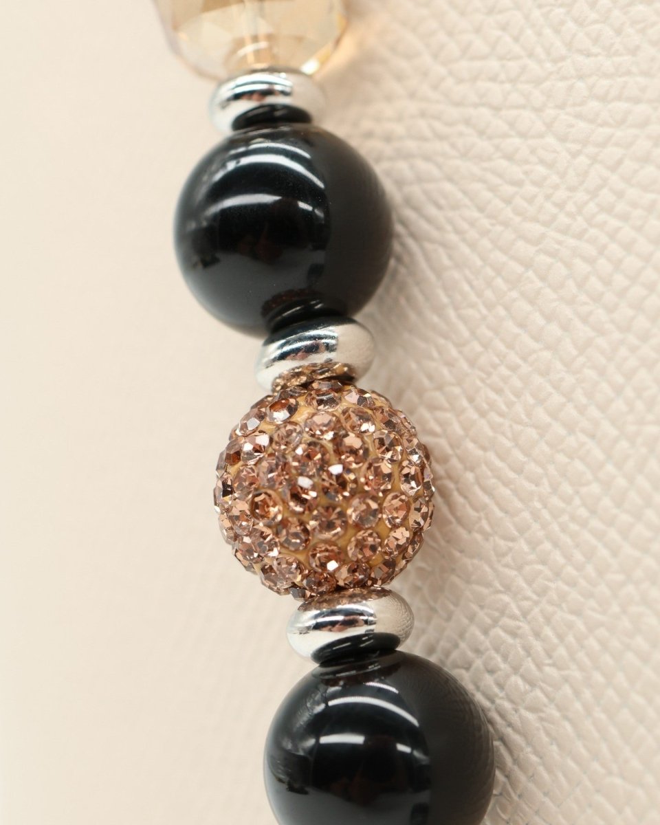 LD Keyfinder Midnight Hive necklace with black obsidian, crystal-embellished beads, and silver accents.