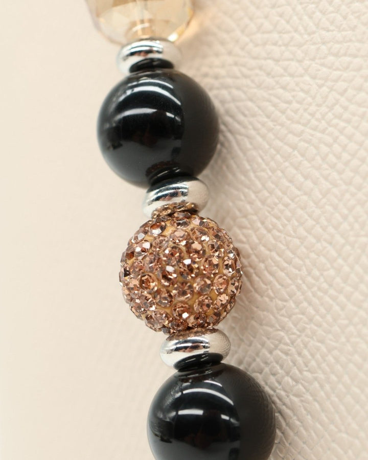 LD Keyfinder Midnight Hive necklace with black obsidian, crystal-embellished beads, and silver accents.