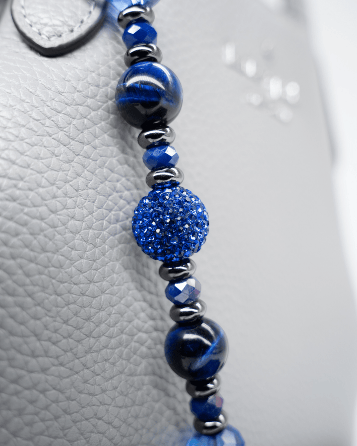 LD Keyfinder Midnight Sapphire beaded accessory with blue tiger eye, Austrian crystals, and gunmetal moon charm