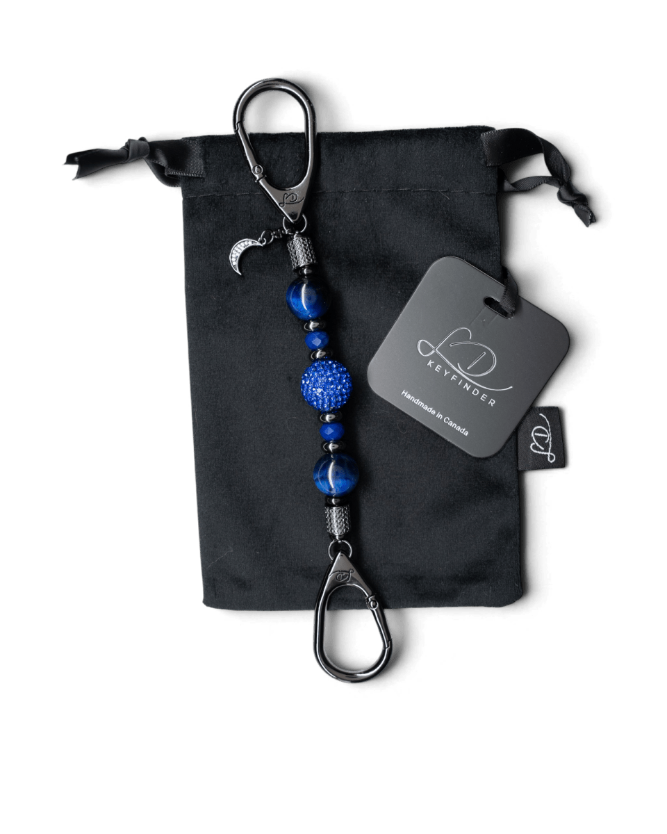 LD Keyfinder Midnight Sapphire Mini keychain with blue tiger eye beads, crystal centerpiece, and moon charm on velvet