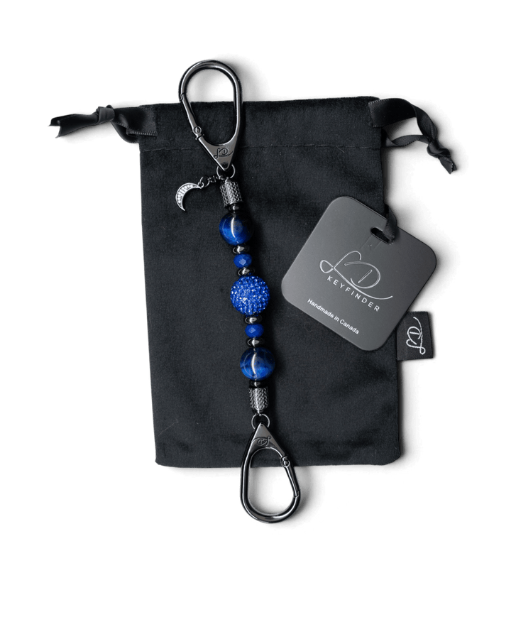 LD Keyfinder Midnight Sapphire Mini keychain with blue tiger eye beads, crystal centerpiece, and moon charm on velvet