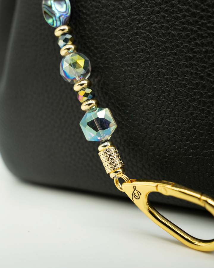 LD Keyfinder Northern Lights beaded bag charm with abalone shell, rainbow crystal beads, and gold-plated hardware.