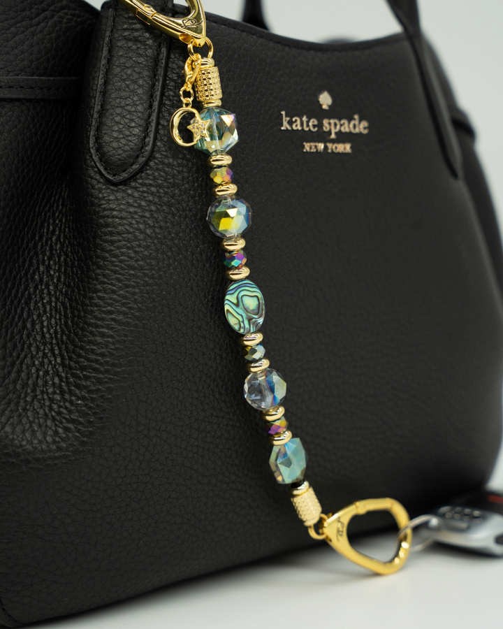 LD Keyfinder Northern Lights beaded keychain with abalone shell, rainbow crystal beads, and gold moon and star charm.